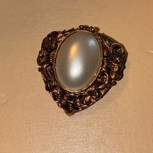Elegant Gold and White Brooch